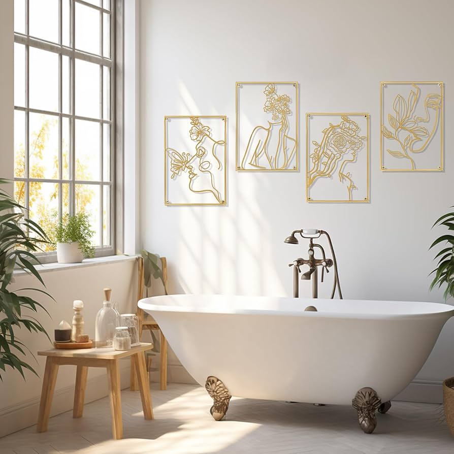 Gold metallic wall sculpture above a modern freestanding bathtub