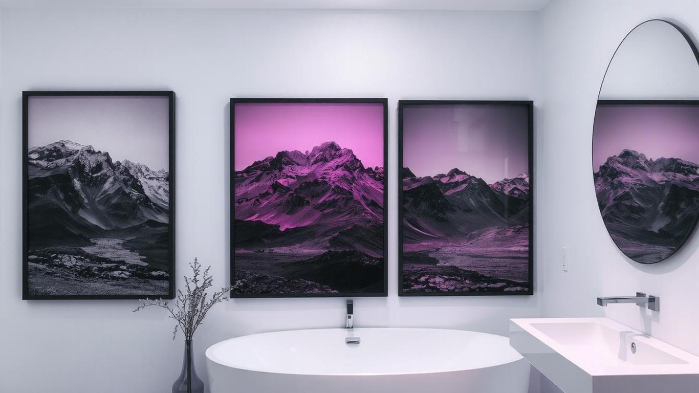 Black and white landscape photography in sleek black frames in a minimalist bathroom